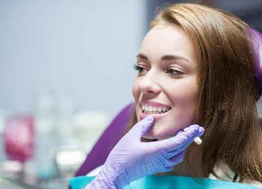 a patient undergoing the dental crown process