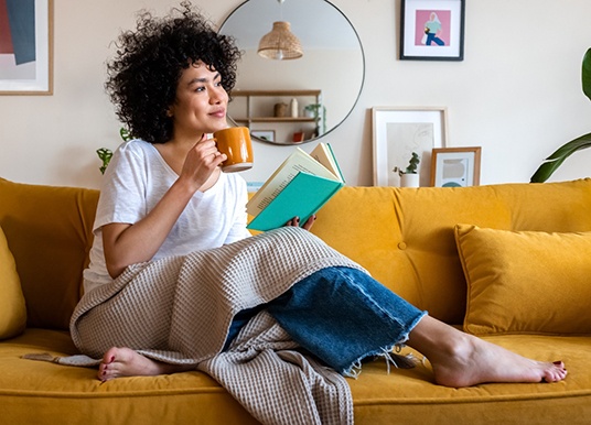 a woman resting on a couch